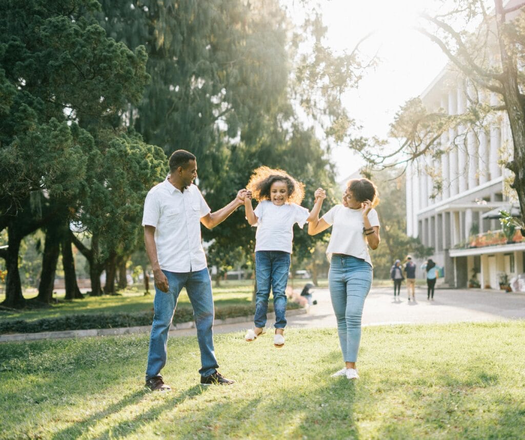 pexels-photo-1128317-1128317 Joyful family enjoying a playful day at the park, embracing love and togetherness under the summer sun.